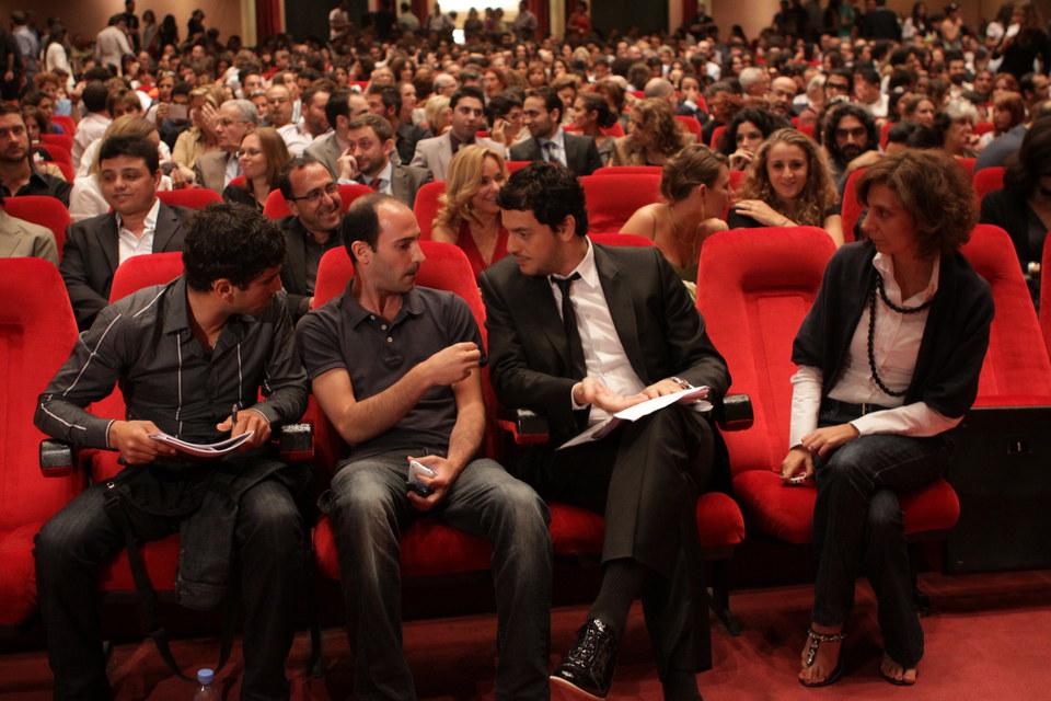 Ceremonies director sitting with Khaled Aboul Naga Jury member discussing ceremony, before closing ceremony