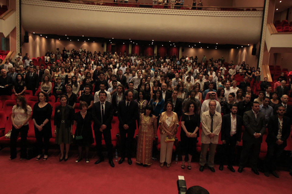 View of the theater singing national anthem before ceremony