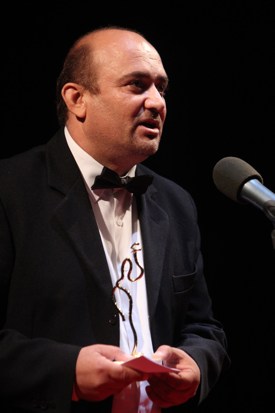 Director Hassan Ali Mahmood, giving a word after receiving his prize for Best Director Feature film for “QUARTER OF THE SCARECROW”