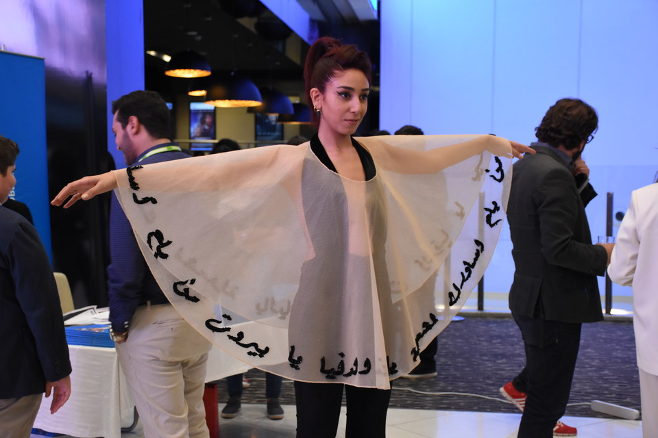 Young student showing her design